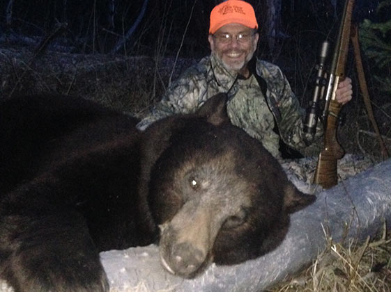 Bill L.'s 400 lb Wyoming chocolate bear taken with his Kilimanjaro 7x57 Walkabout rifle.