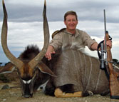 Kilimanjaro Custom Rifles Founder Erik Eike and Trophy of African Nyala